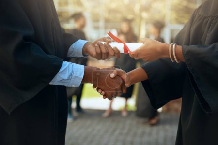 Photo for Handshake, graduation and hands with certificate at a college for education or scholarship. Support, thank you and a university graduate shaking hands with a teacher for certification and achievement. - Royalty Free Image