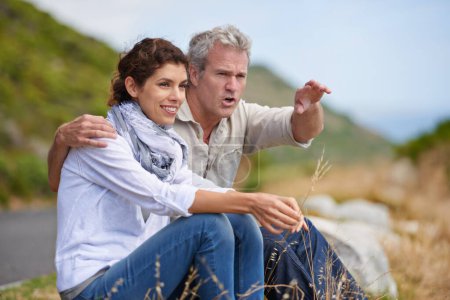Photo for Taking in the scenery. Portrait of a mature couple sitting in the countryside - Royalty Free Image