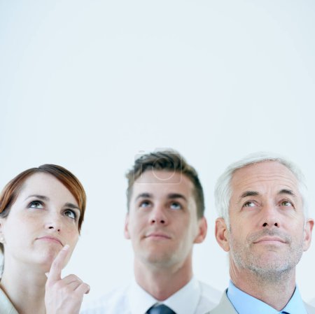 Photo for Thinking of the best course of action. a three corporate coworkers in an office - Royalty Free Image