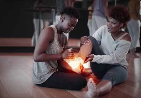 Photo for Feet, pain or injury and woman helping friend on floor at fitness studio with burnout or health problem. Female person with exercise partner and red anatomy glow for support, accident and first aid. - Royalty Free Image