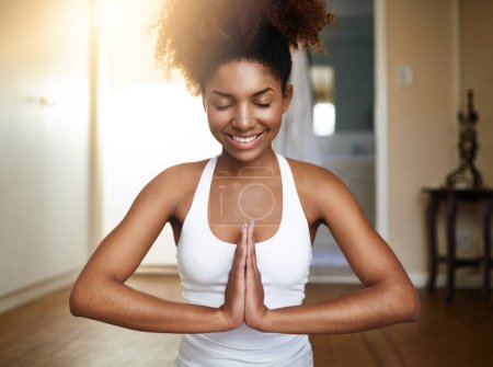 Photo for Happy woman, hands and yoga in namaste for meditation, spiritual wellness or zen workout at home. Calm African female yogi smile with hand together in mediate for health, mind and fitness exercise. - Royalty Free Image