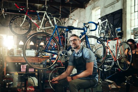 Photo for Portrait, tools and serious repair man in bicycle shop, store or cycling workshop. Face, bike mechanic and male person, business owner or mature professional technician with glasses and confidence - Royalty Free Image