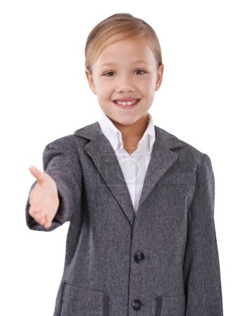 Photo for Thinking up her next character. Studio shot of a young girl pretending she is a businesswoman and extending her arm out in greeting - Royalty Free Image