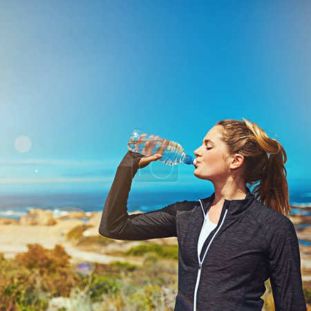 Photo for Woman drink water, health and fitness with blue sky, athlete outdoor with hydration and mockup space. Exercise at beach, female person drinking h2o from bottle with workout and break from training. - Royalty Free Image