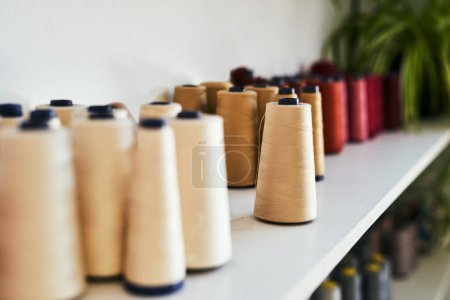 Photo for May your bobbin always be full. spools of thread on a shelf - Royalty Free Image