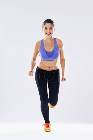Photo for Working up a sweat. Studio shot of an attractive young woman working out - Royalty Free Image