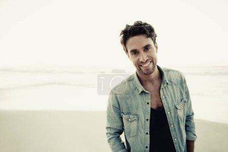 Photo for Theres no better place to relax. a handsome young man on the beach - Royalty Free Image