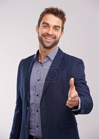 Photo for Business man in portrait, smile and shaking hands with agreement and hiring on studio background. Corporate deal, recruit with thank you or welcome handshake with collaboration and professional male. - Royalty Free Image