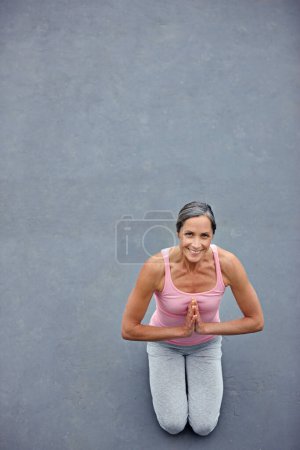 Photo for Mockup, yoga and portrait of old woman with praying hands on floor for meditation, healing and balance from above. Mindfulness, prayer pose and space for elderly lady meditating for zen or wellness. - Royalty Free Image