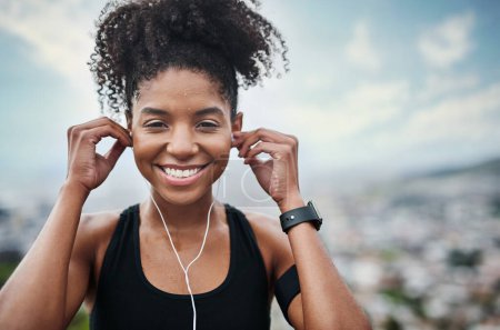 Photo for Fitness, earphones and portrait of woman outdoor with music for training, running or cardio. Radio, smile and face of African female runner with podcast for workout motivation, exercise and sport run. - Royalty Free Image