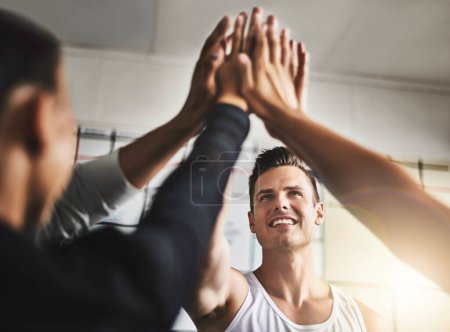 Photo for Success, teamwork and high five of people in gym for motivation, support and target. Workout, exercise and training with hands of friends in sports center for team building, challenge and achievement. - Royalty Free Image
