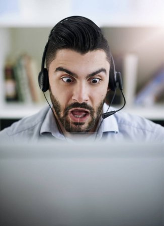 Photo for Stressed, frustrated or shocked man in call center reading fake news crisis or mistake with panic in office. Worried virtual assistant, anxiety or surprised consultant frustrated with computer error. - Royalty Free Image