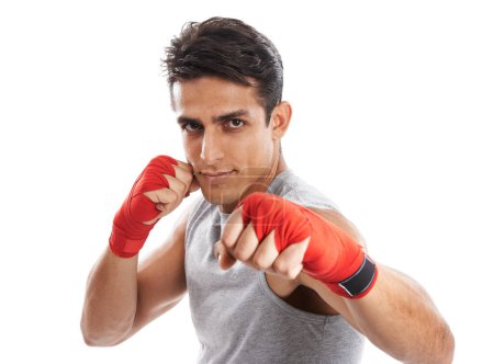 Photo for Perfecting his punches. Portrait of a handsome young kick-boxer punching against a white background - Royalty Free Image