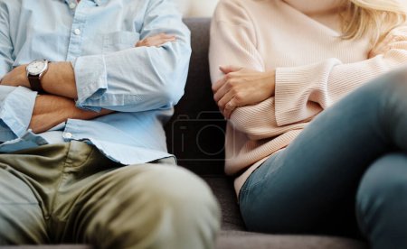 Photo for Divorce, sad and couple fight due on a couch due to marriage problem or conflict in a lounge sofa. Anger, fail and angry people or partner frustrated in a living room due to cheating or argument. - Royalty Free Image