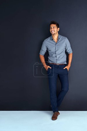 Photo for Happy, fashion and space with business man in studio for professional, mission and mockup. Pride, mindset and expert with male employee on dark background for entrepreneur, happiness and style. - Royalty Free Image