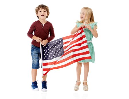 Photo for They pledge their allegiance. Studio shot of a cute little boy and girl holding the American flag against a white background - Royalty Free Image