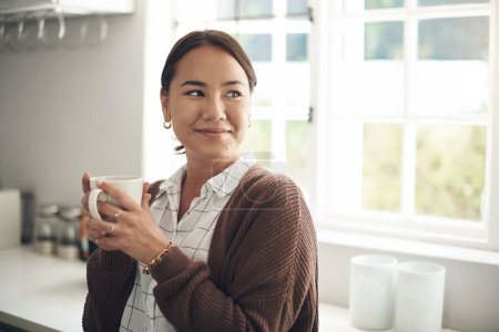 Photo for At home to enjoy a chilled day. a young woman drinking coffee at home - Royalty Free Image