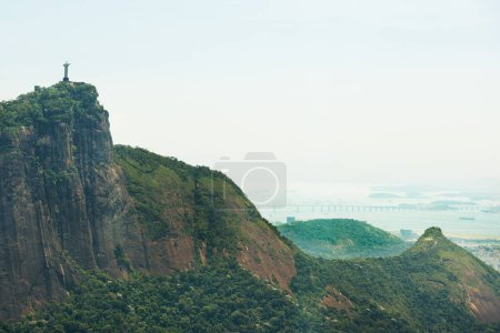 Photo for Mountain, nature and Christ the Redeemer in Brazil for tourism, sightseeing and travel destination. Landscape, Rio de Janeiro and drone view of statue, sculpture and landmark on hill background. - Royalty Free Image