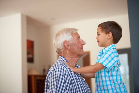 Photo for Im taller than you, grandpa. a little boy bonding with his grandfather - Royalty Free Image