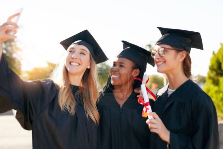 Photo for Women, friends and graduation selfie for college or university students together with a smile. Happy people outdoor to celebrate education achievement, success or future at event for school graduates. - Royalty Free Image