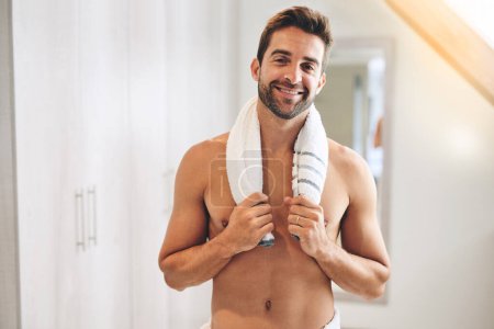 Photo for Time for a shower. Cropped portrait of a handsome young man holding a towel around his neck in his bathroom at home - Royalty Free Image