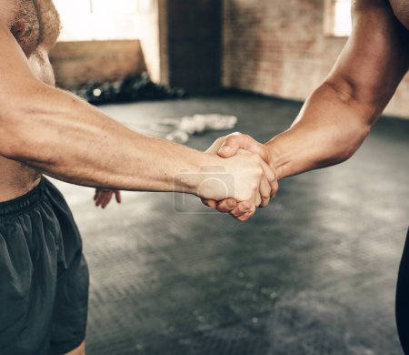 Photo for Double the strength. two unrecognizable men greeting each other with a handshake on a good workout exercise in the gym - Royalty Free Image