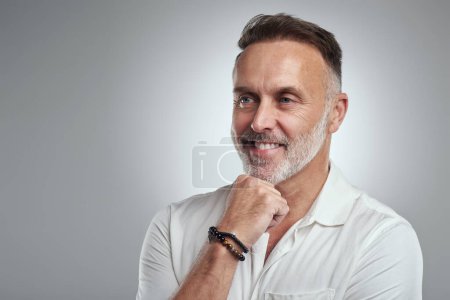 Photo for He has a great mind filled with great ideas. Studio shot of a mature man looking thoughtful against a grey background - Royalty Free Image