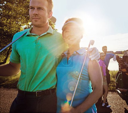 Photo for That sure was a good game of golf. two couples playing a round of golf together on a sunny day - Royalty Free Image
