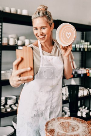 Photo for Happy woman, pottery and smile in small business selfie for social media, advertising or vlog at store. Female person or retail owner smiling with clay bowl for photo or online post on smartphone. - Royalty Free Image