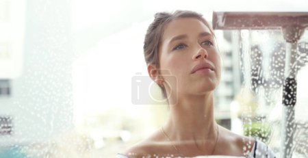 Photo for Woman, face and clean window with soap and detergent, chemical liquid and housekeeping with focus. Female cleaner with foam, cleaning glass and disinfectant with hygiene, housekeeper and mockup space. - Royalty Free Image