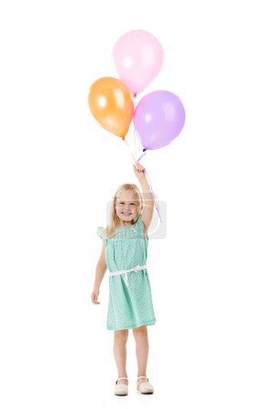 Foto de Chica del cumpleaños. Estudio de una linda niña sosteniendo un montón de globos sobre un fondo blanco - Imagen libre de derechos