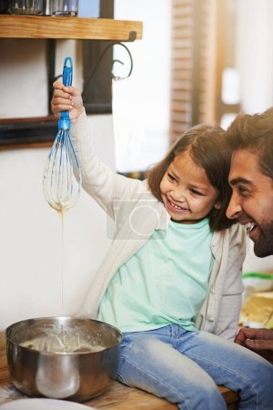 Photo for Cooking, morning and father with daughter in kitchen for pancakes, bonding and learning. Food, breakfast and helping with man and young girl in family home for baking, support and teaching nutrition. - Royalty Free Image