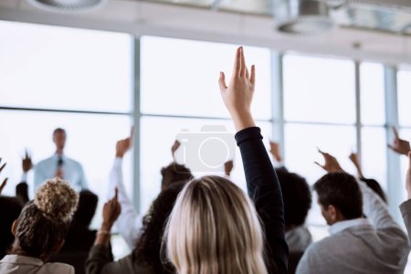 Photo for Conference, group and business people with hands for a vote, question or volunteering. Corporate event, meeting and hand raised in a training seminar for questions, voting or audience opinion. - Royalty Free Image