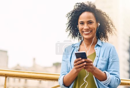 Photo for Happy, music and portrait of woman in city with phone listening to track, audio and mockup in urban town. Traveling, smile and beautiful African female person streaming radio for relaxing on weekend. - Royalty Free Image
