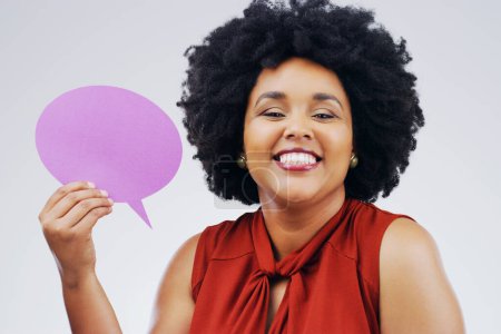 Photo for Happy woman, portrait smile and holding speech bubble for question, FAQ or social media against a white studio background. Female person smiling with afro or sign for comment, message or mockup space. - Royalty Free Image