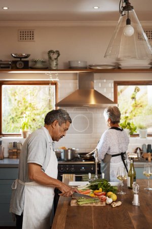 Photo for Help, vegetables and old man with woman at kitchen counter, cooking and healthy marriage bonding in home. Marriage, love and food, senior couple at meal prep time for vegetable dinner in retirement - Royalty Free Image