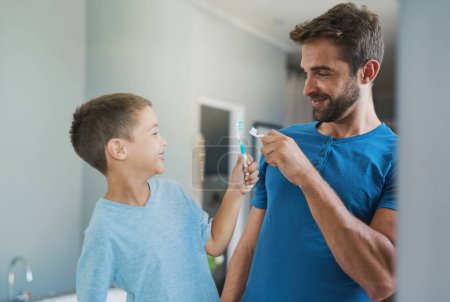 Photo for Boom. Toothbrush, brushing teeth and father with son bathroom for morning routine, bonding and dental. Oral hygiene, cleaning and smile with man and child in family home for self care and wellness - Royalty Free Image