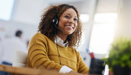 Photo for Happy african woman, call center agent or listen on voip headset for consulting, communication or contact. Girl, customer service or tech support crm with smile, headphones or microphone at help desk. - Royalty Free Image