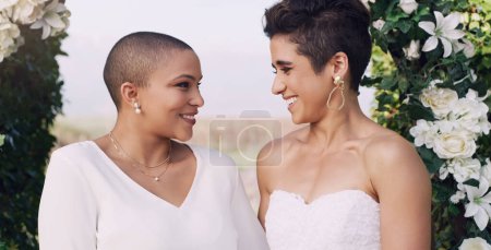 Photo for Love, marriage and lgbtq with lesbian couple at wedding for celebration, gay and pride. Smile, spring and happiness with women at ceremony event for partner commitment, queer relationship and freedom. - Royalty Free Image