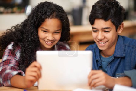 Photo for School, tablet and happy children in classroom with learning, internet website and young students. Digital education, kids elearning and Montessori class, happiness and studying with online reading,. - Royalty Free Image