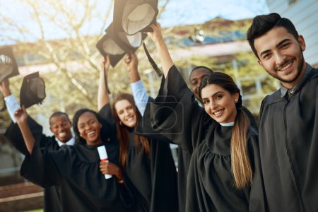 Photo for University, graduation and hats off or group of students together with joy or celebrating academic achievement and outdoors. Certification, victory and happy scholars outside or diversity and robes. - Royalty Free Image