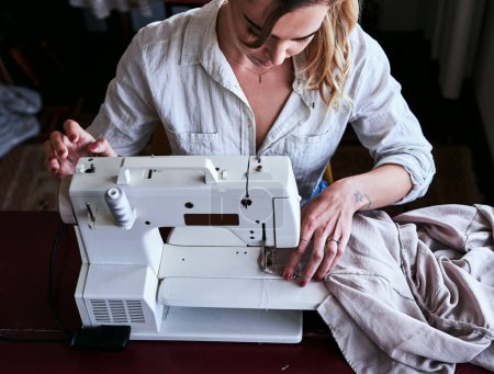 Photo for Fashion, design and woman at sewing machine from above, small business with creative ideas and focus at workshop. Creativity, textile start up and designer, tailor or entrepreneur at table stitching - Royalty Free Image