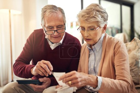 Photo for Financial, investment and budget with an old couple in their home for retirement or pension planning. Debt bills, money or insurance with a senior man and woman in their house for finance strategy. - Royalty Free Image