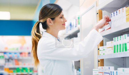 Pharmacy, product shelf and happy woman, pharmacist or chemist search for pills, supplements or pharmaceutical. Hospital retail dispensary, medicine and medical person fixing box package display.