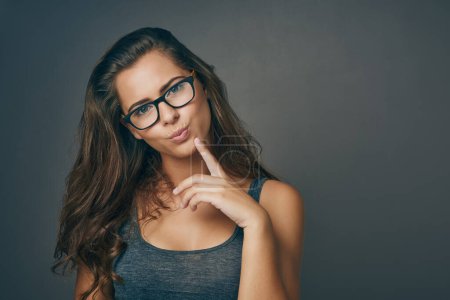 Photo for Sometimes all you need is a new perspective. Studio shot of an attractive young woman wearing glasses - Royalty Free Image