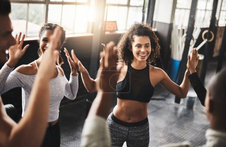 Photo for They dont regret signing up for that gym membership. a group of young people working out together in a gym - Royalty Free Image