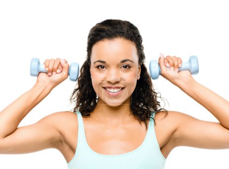 Photo for Time to get your pump on. a beautiful young woman working out against a studio background - Royalty Free Image