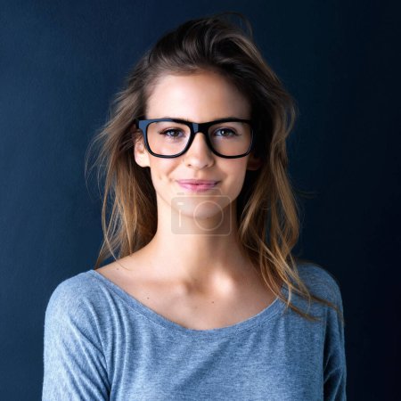 Photo for Studio, teenager or portrait of a girl for fashion, beauty or eyewear with vision isolated on dark background. Style, happy or face of a beautiful young woman or confident model with glasses or smile. - Royalty Free Image