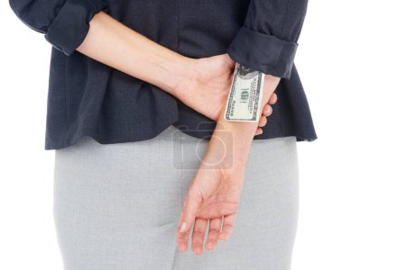 Photo for Hiding her bribe. a businesswoman with a 100 dollar bill up her sleeve - Royalty Free Image