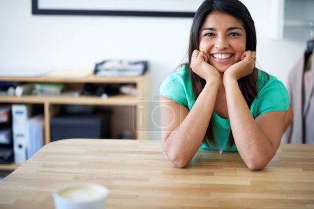 Photo for Its not work when you love your job. Portrait of a young female designer at her desk - Royalty Free Image